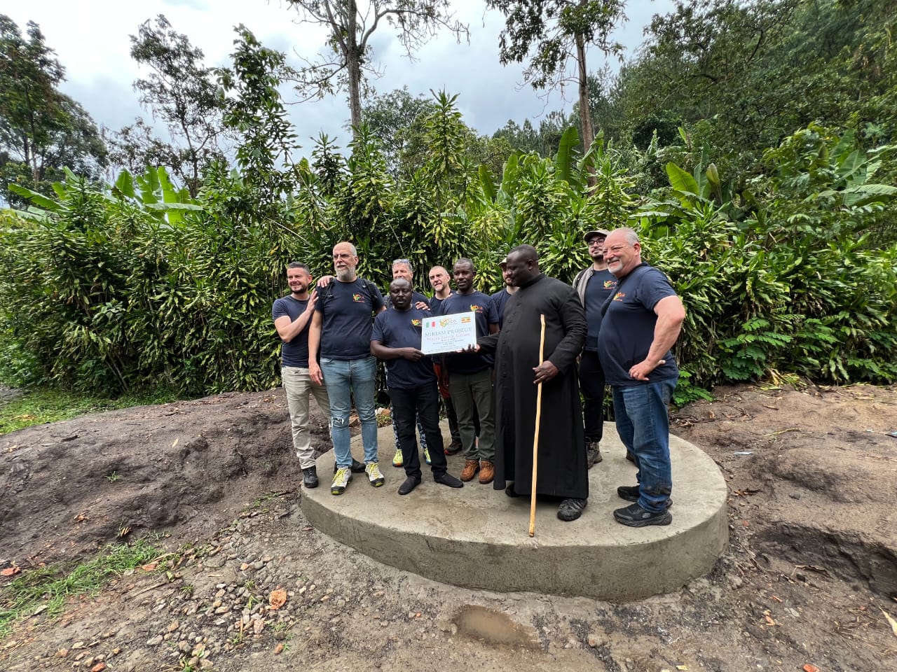 AICO ODV representatives gathered at the Miriam Project water system site in Uganda